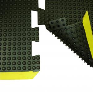 A close up of the bubble anti fatigue mat suction cups to stick it to the floor and a bevelled yellow safety border.