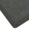 The corner of the plush stand anti fatigue mat is pictured close-up. It has grey and white salt-and-pepper style fibres.