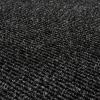 A close-up view of a dark gray textured carpet surface, featuring tightly looped fibers and a ribbed pattern.