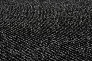 A close-up view of a dark gray textured carpet surface, featuring tightly looped fibers and a ribbed pattern.